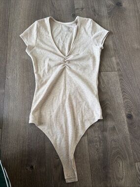 Beige Ribbed V-Neck Short Sleeve Bodysuit with Gathered Front